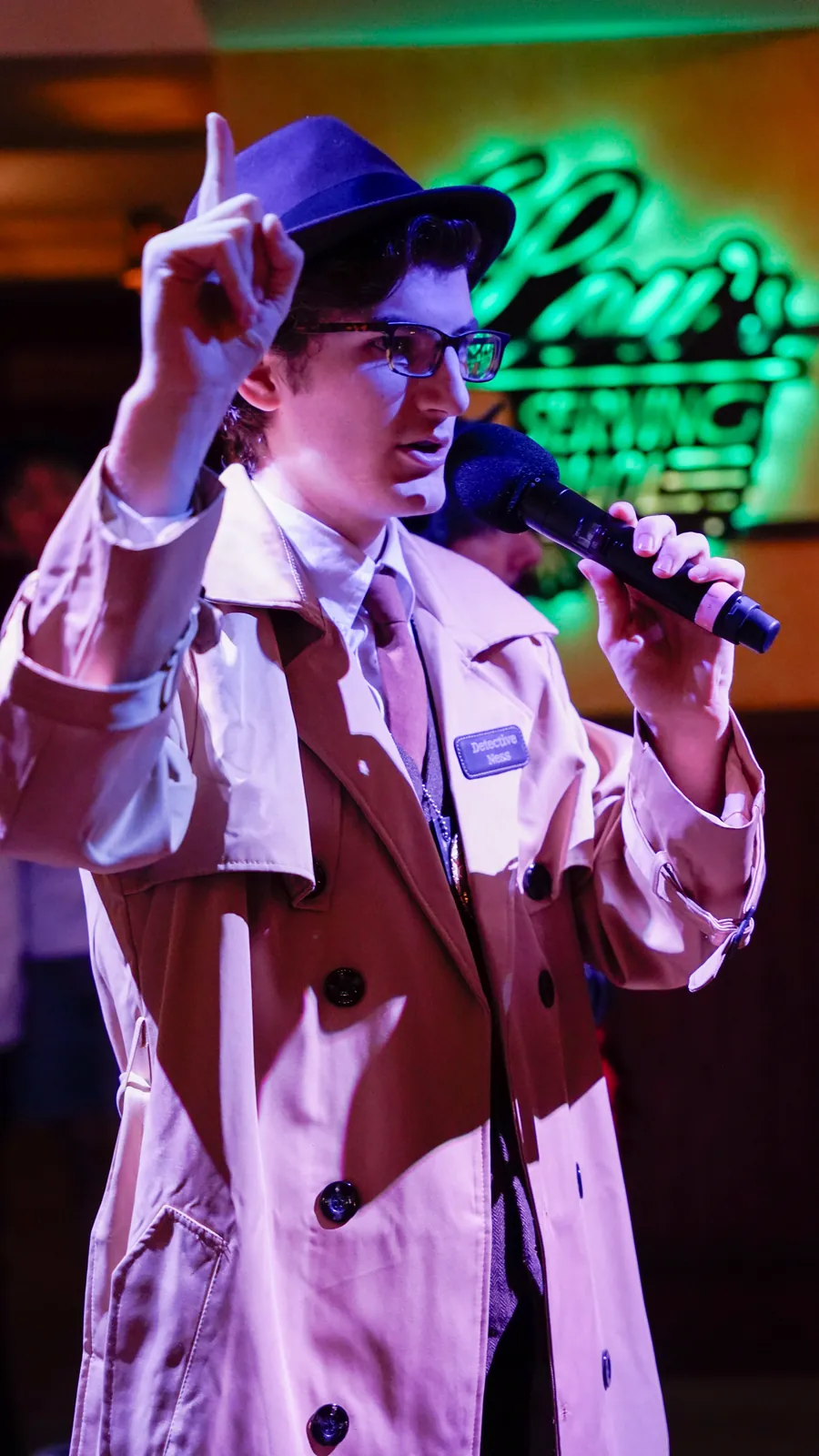 A Murder Mystery Company actor working the room at a Charleston show